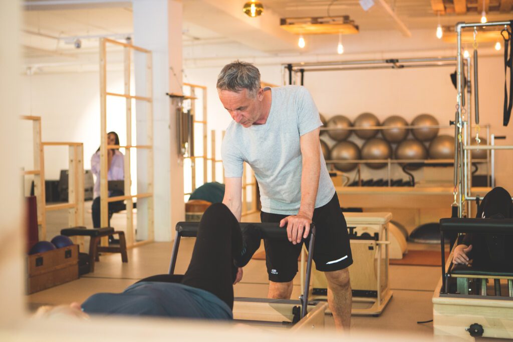 Active slim woman in sport clothes does pilates exercises and stretches  outdoor, has glad expression, good flexibility, enjoys morning workout in  fresh air. People, lifestyle, wellbeing concept 7905684 Stock Photo at  Vecteezy